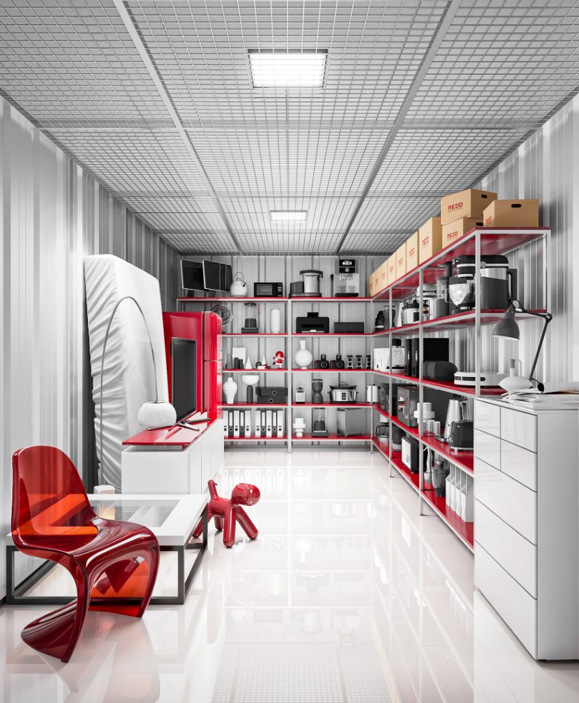 REDD Self Storage — an immaculate storage unit in red and white, styled with shelving and a red designer chair