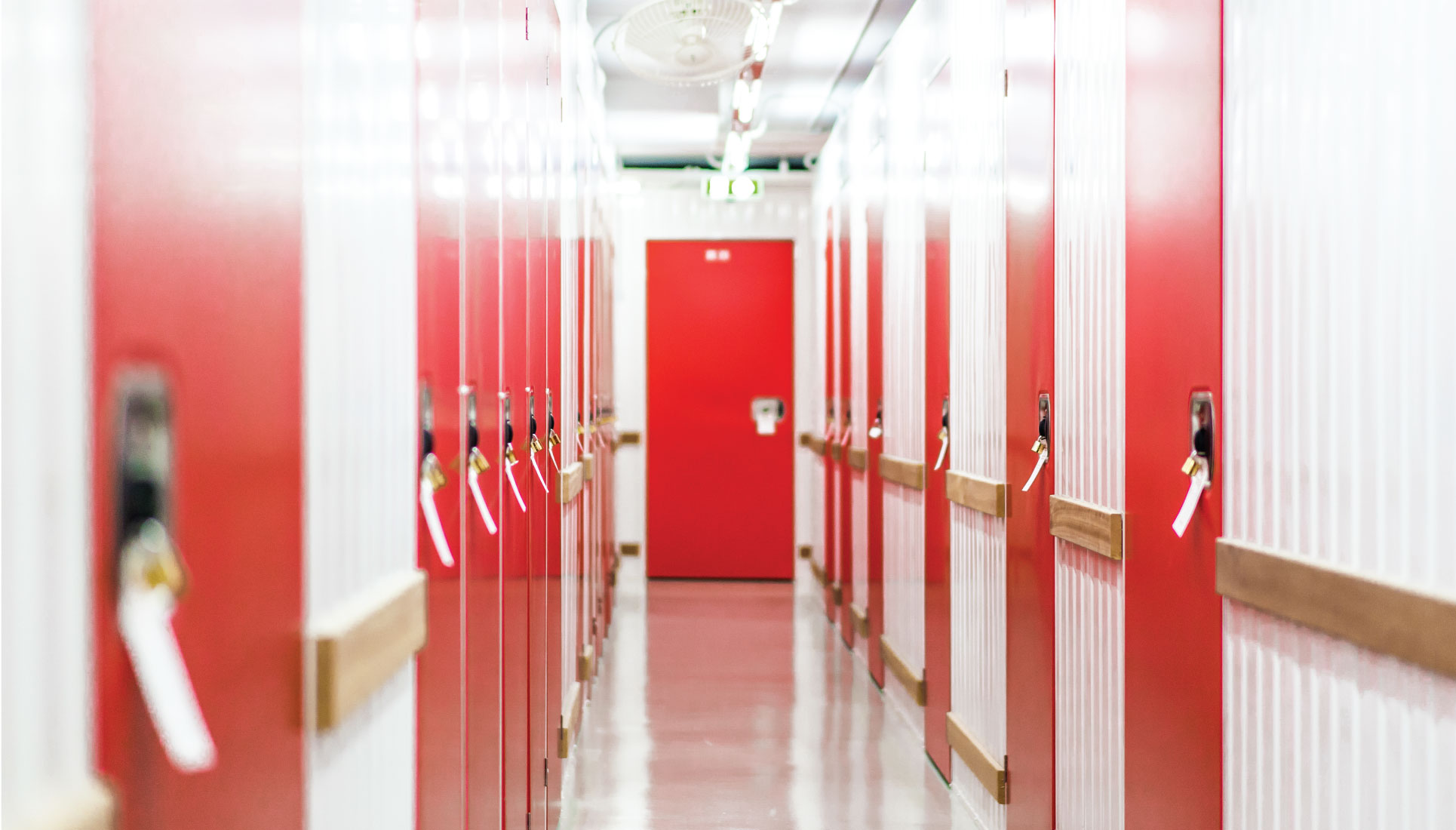Humidity-controlled corridor of red and white storage units