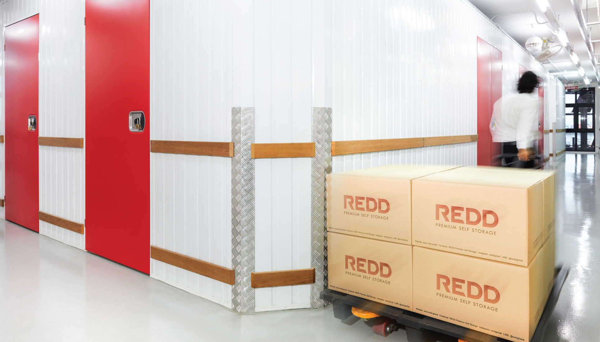 Facility corridor with a pallet of REDD-branded boxes ready to move in